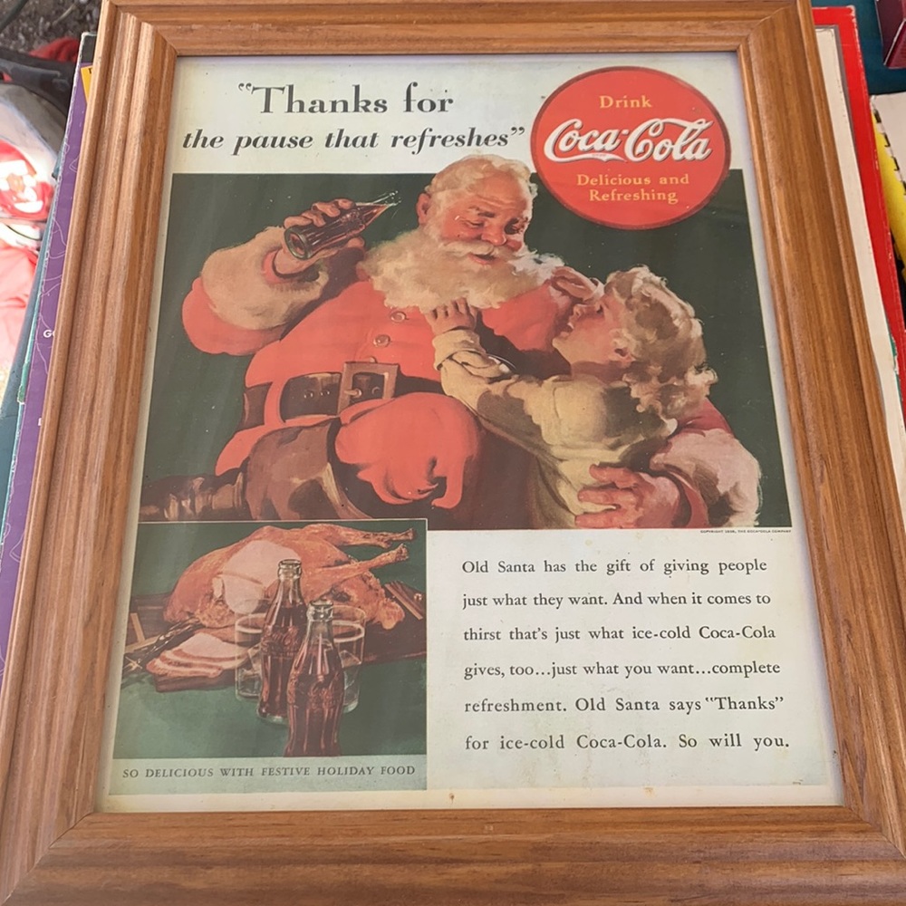 Coca-Cola picture of Santa Claus in a little girl.